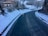 a car is driving down a snowy road