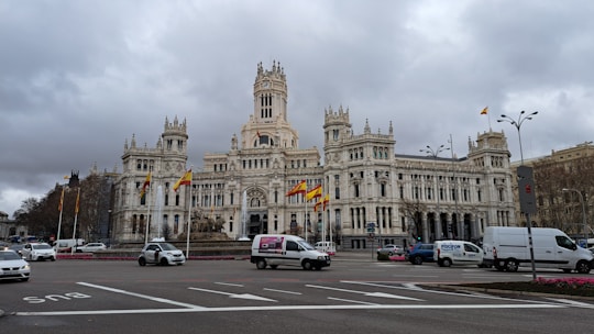 a large white building with a clock tower