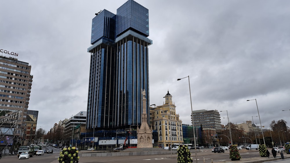 a group of fire fighters standing in front of a tall building