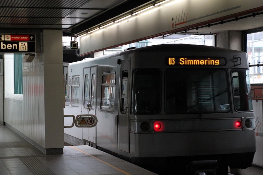 a subway train pulling into a train station