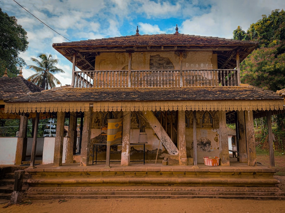 an old building with a porch and a balcony