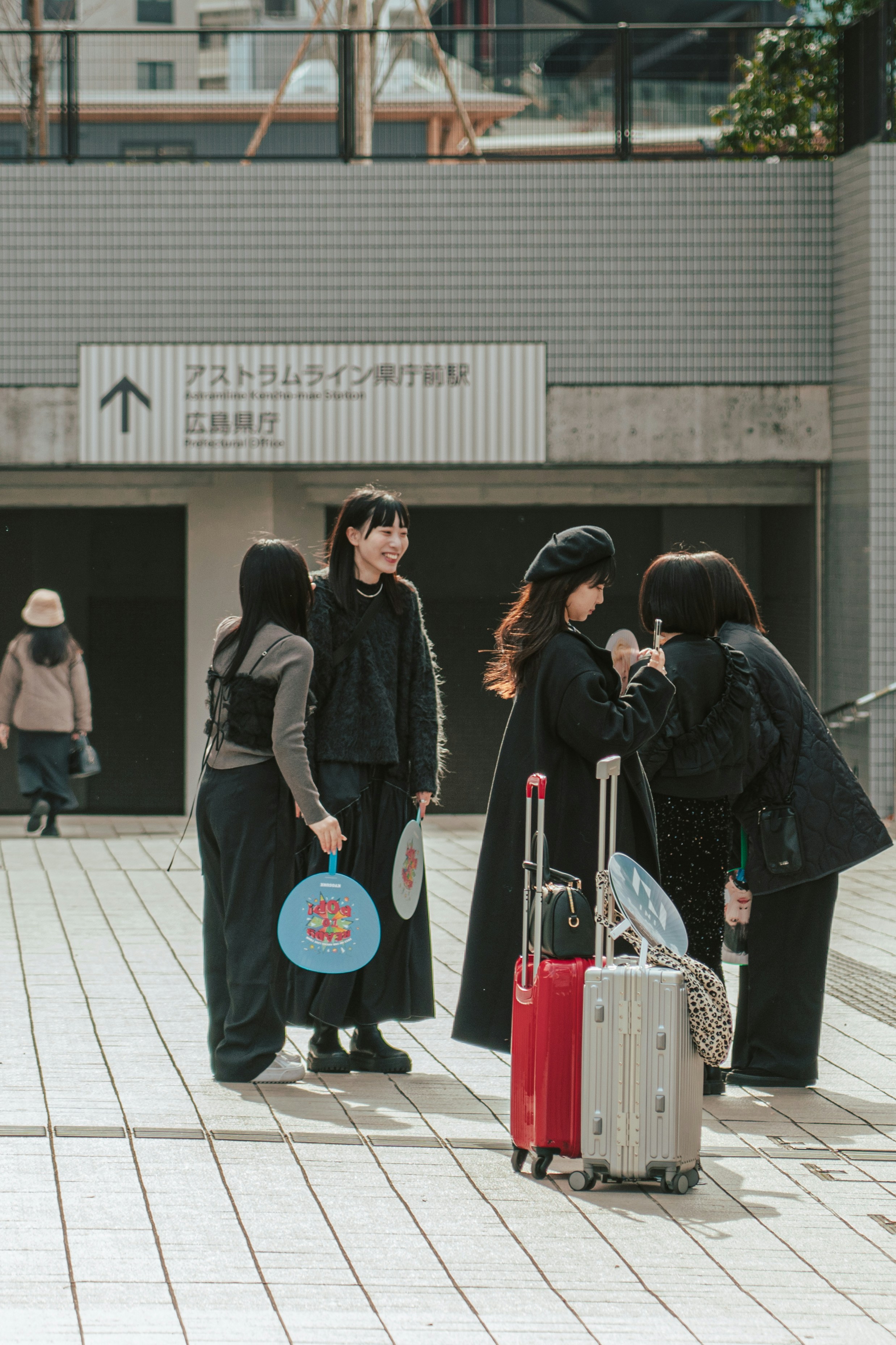 a group of people standing around with luggage