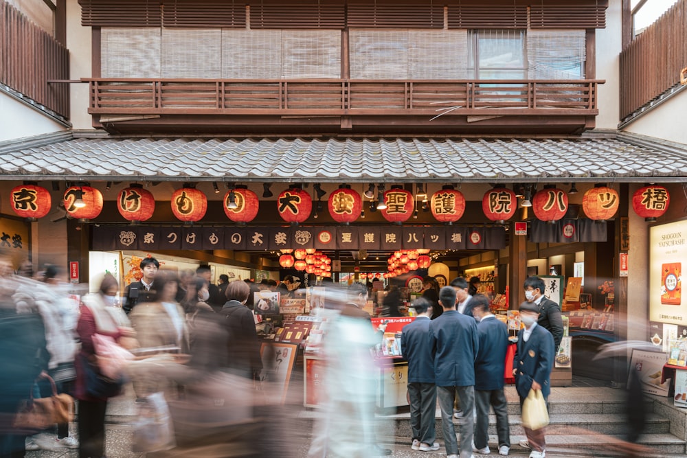 a group of people standing in front of a store