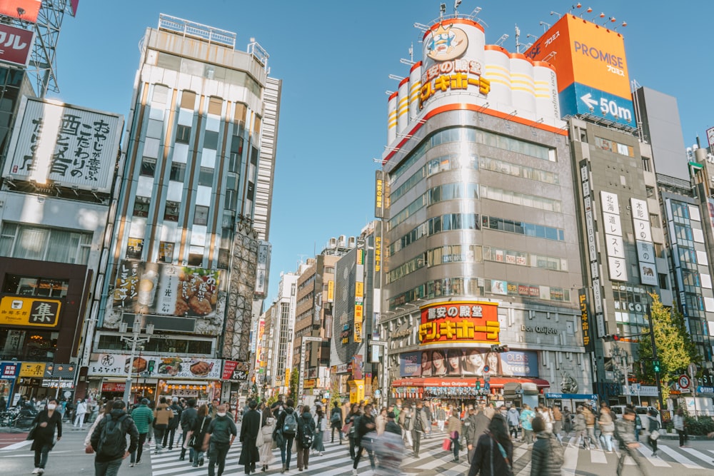 a busy city street filled with lots of people