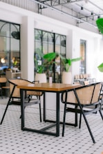a table and chairs in a large room