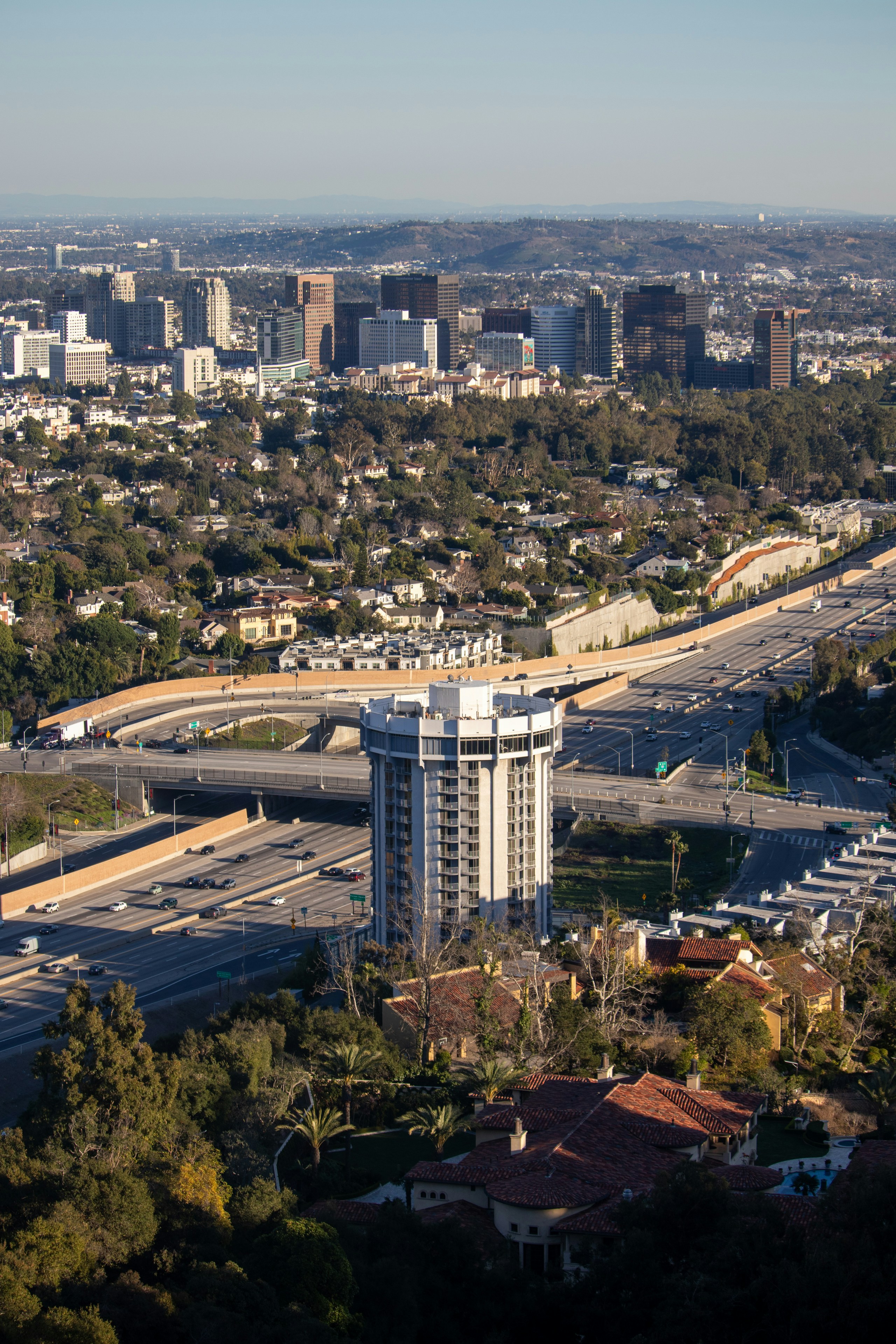 an aerial view of a city with tall buildings
