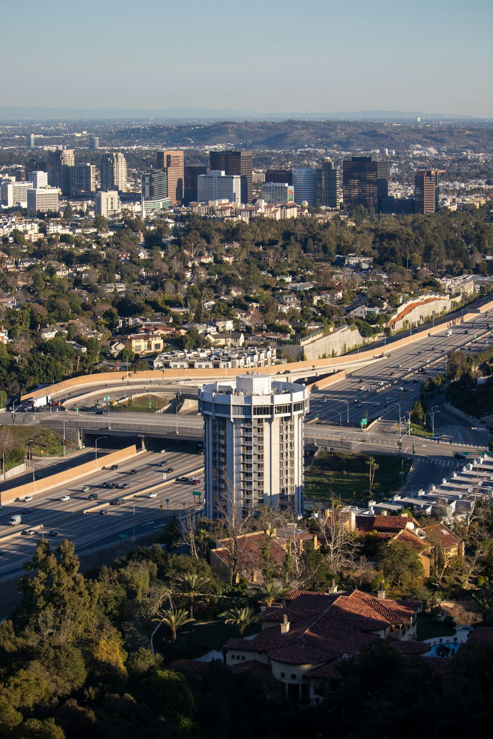 an aerial view of a city with tall buildings