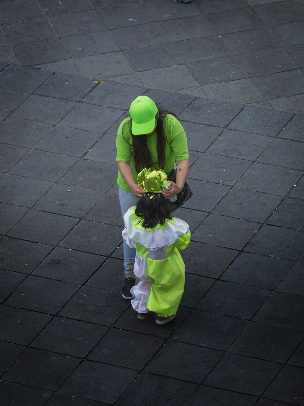 a man in a green hat and a woman in a green dress