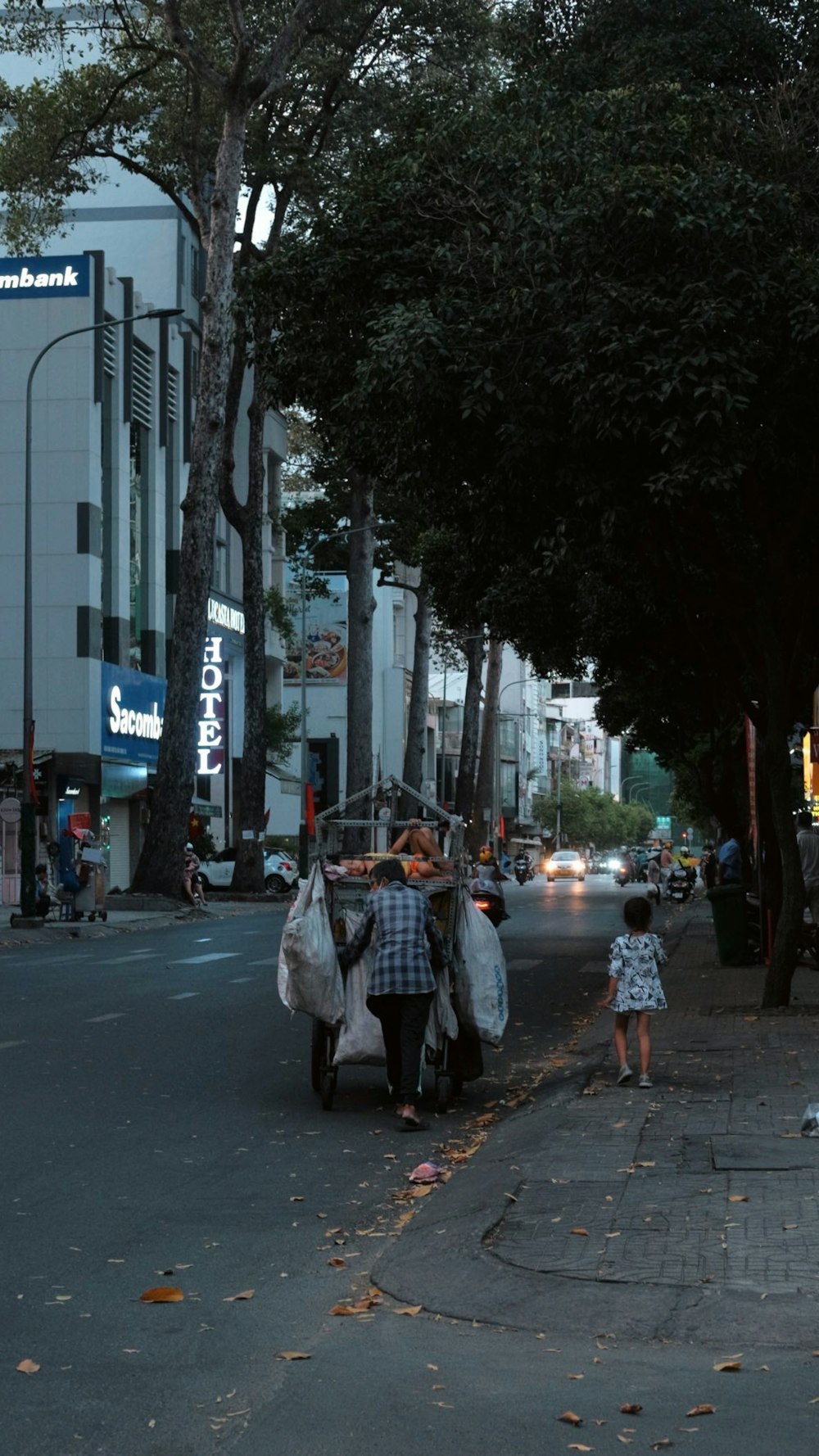 a group of people walking down a street