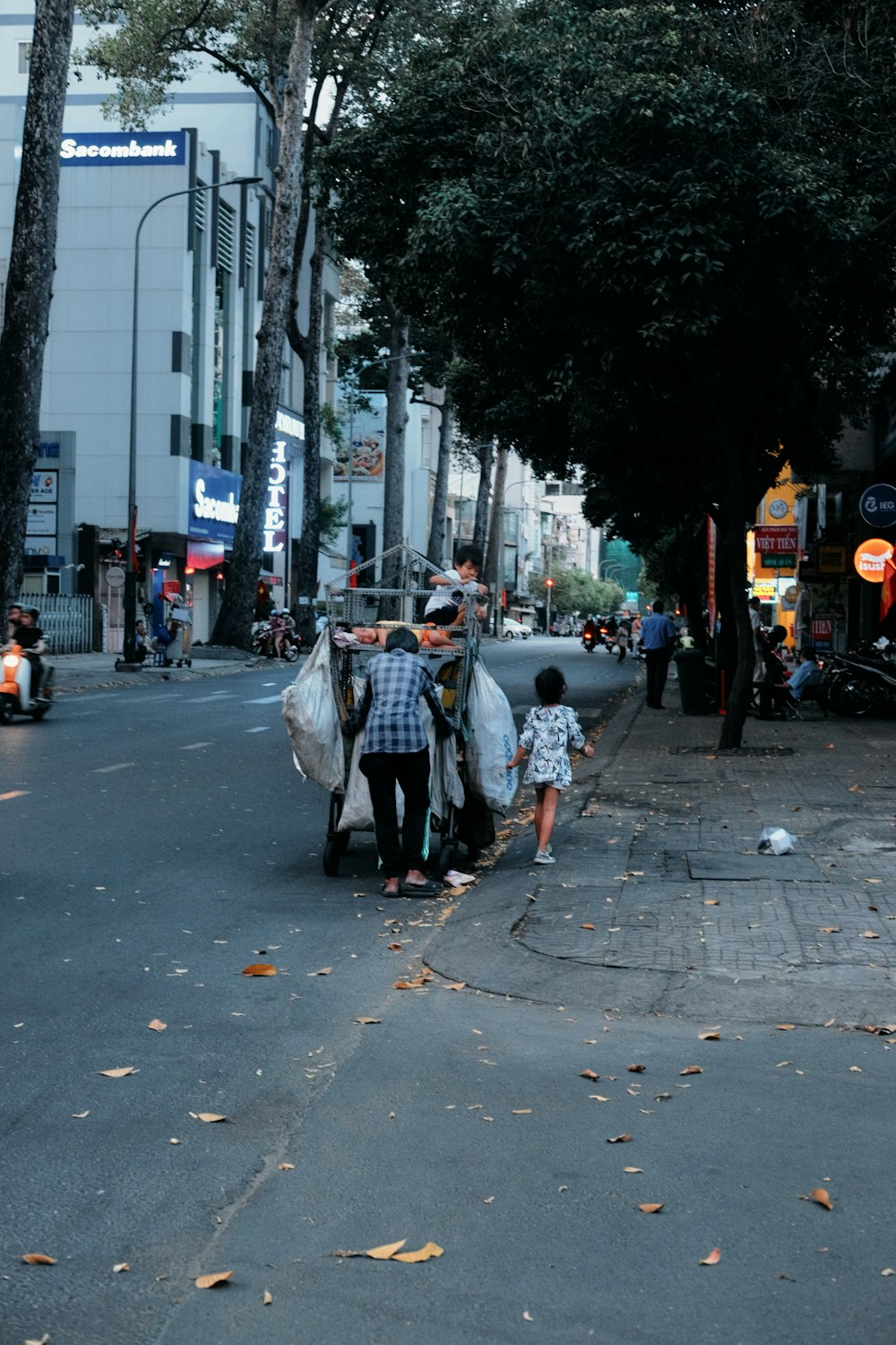 a group of people walking down a street