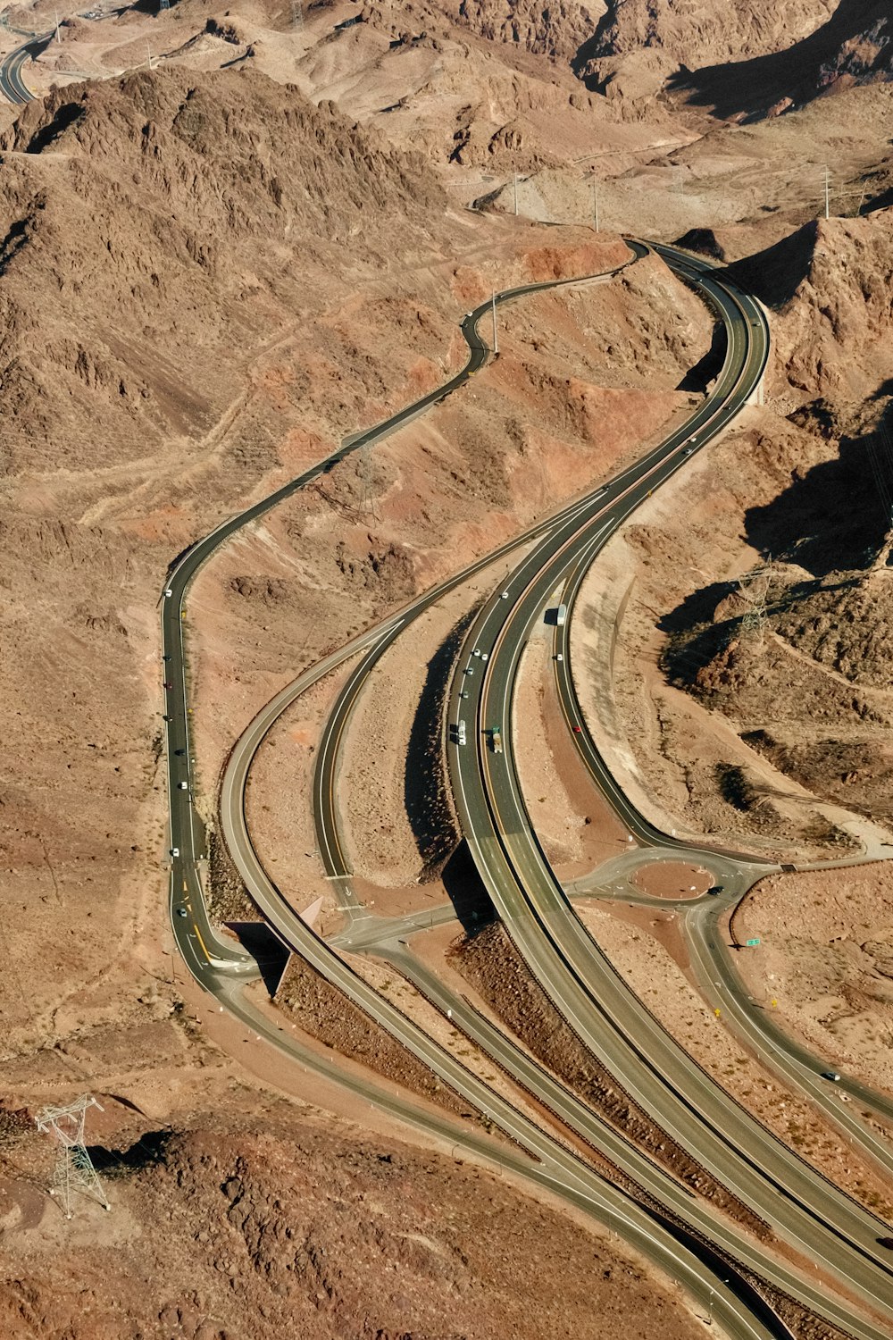 an aerial view of a highway in the desert