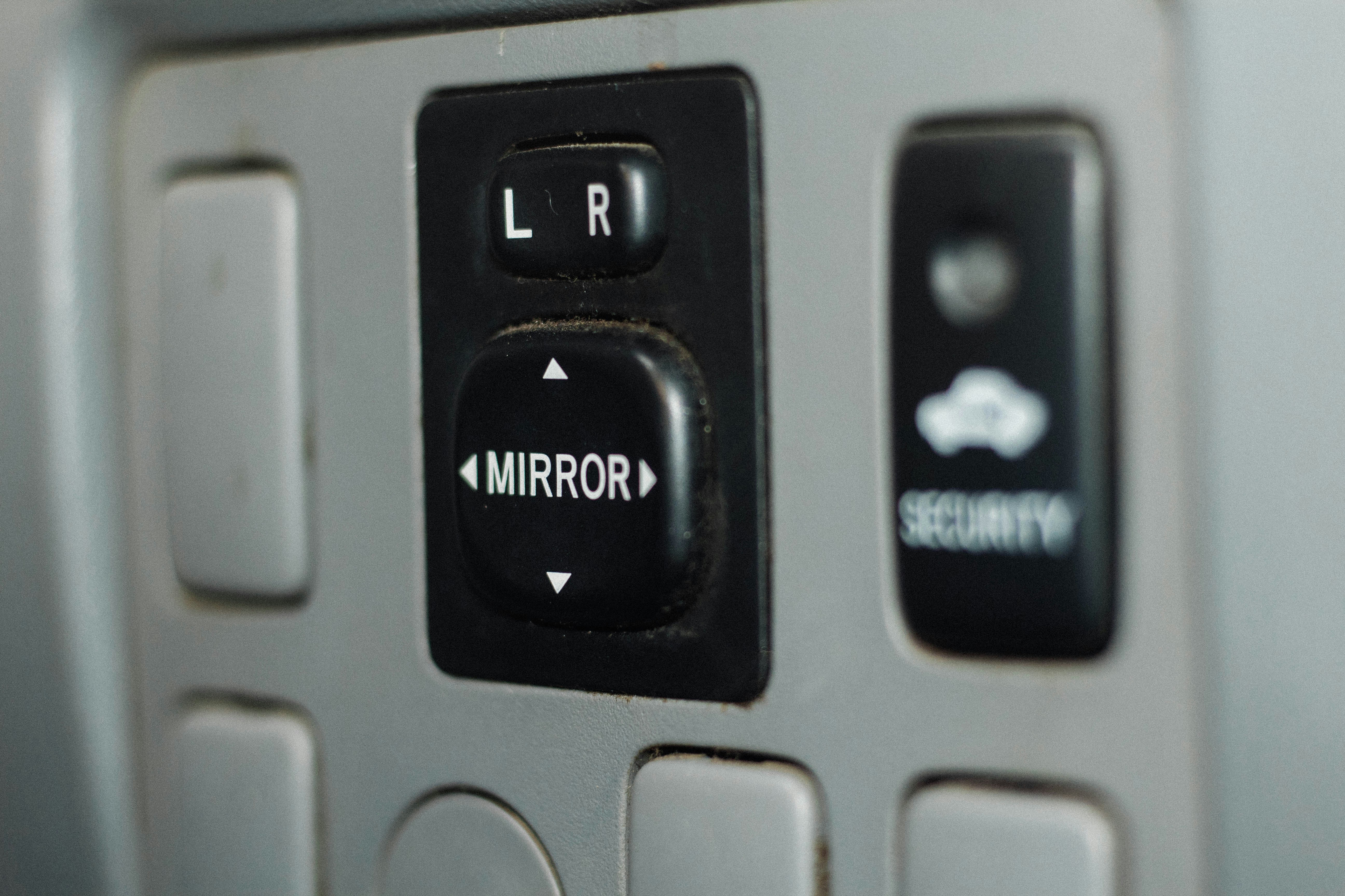 Hybrid car dashboard showing high fuel economy on trip computer