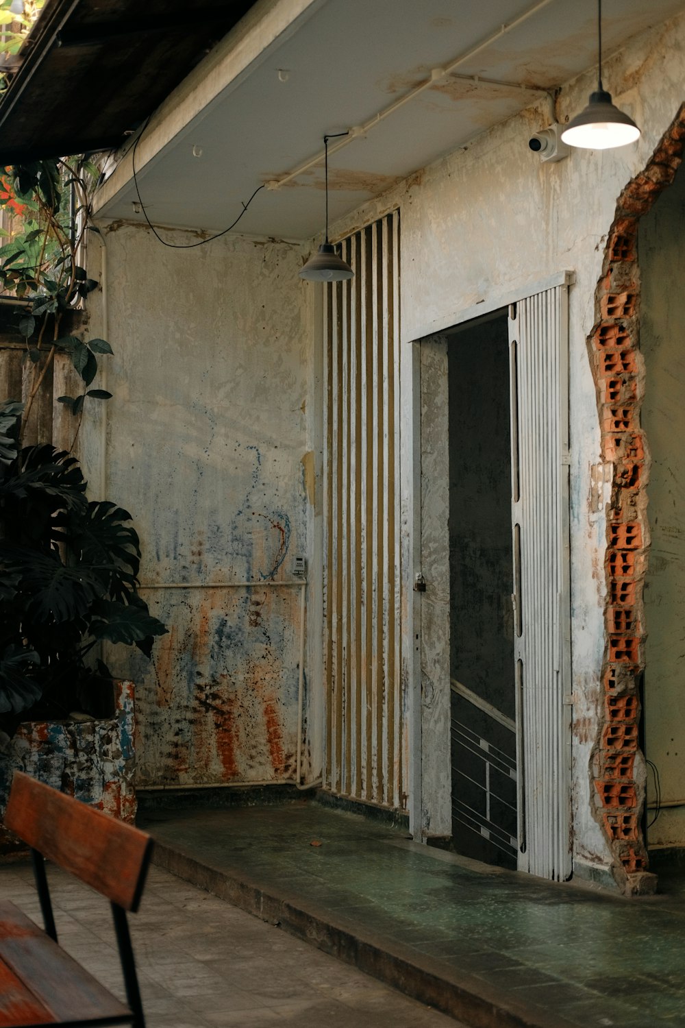 a wooden bench sitting in front of a building