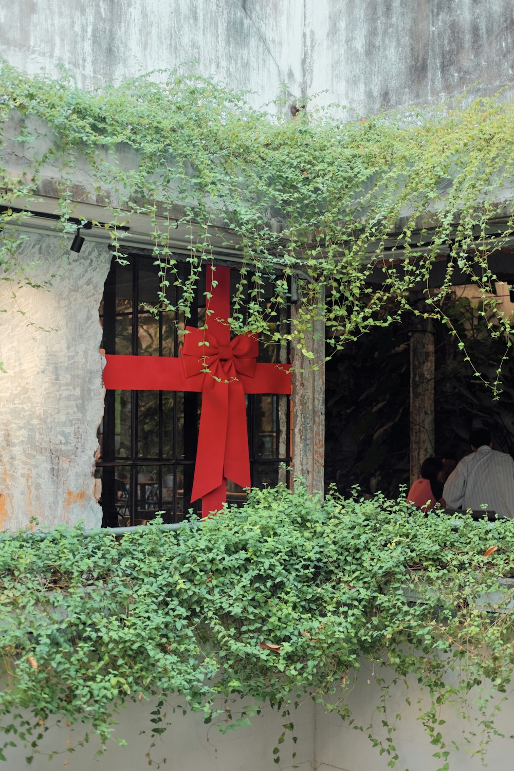 a red cross on the side of a building