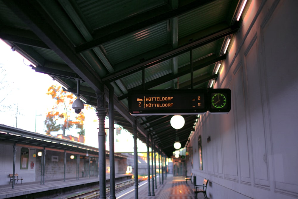 a train station with a train on the tracks