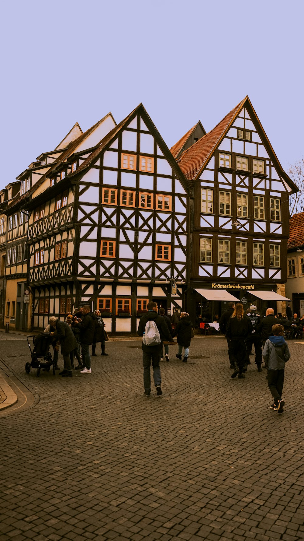 a group of people standing in front of a building