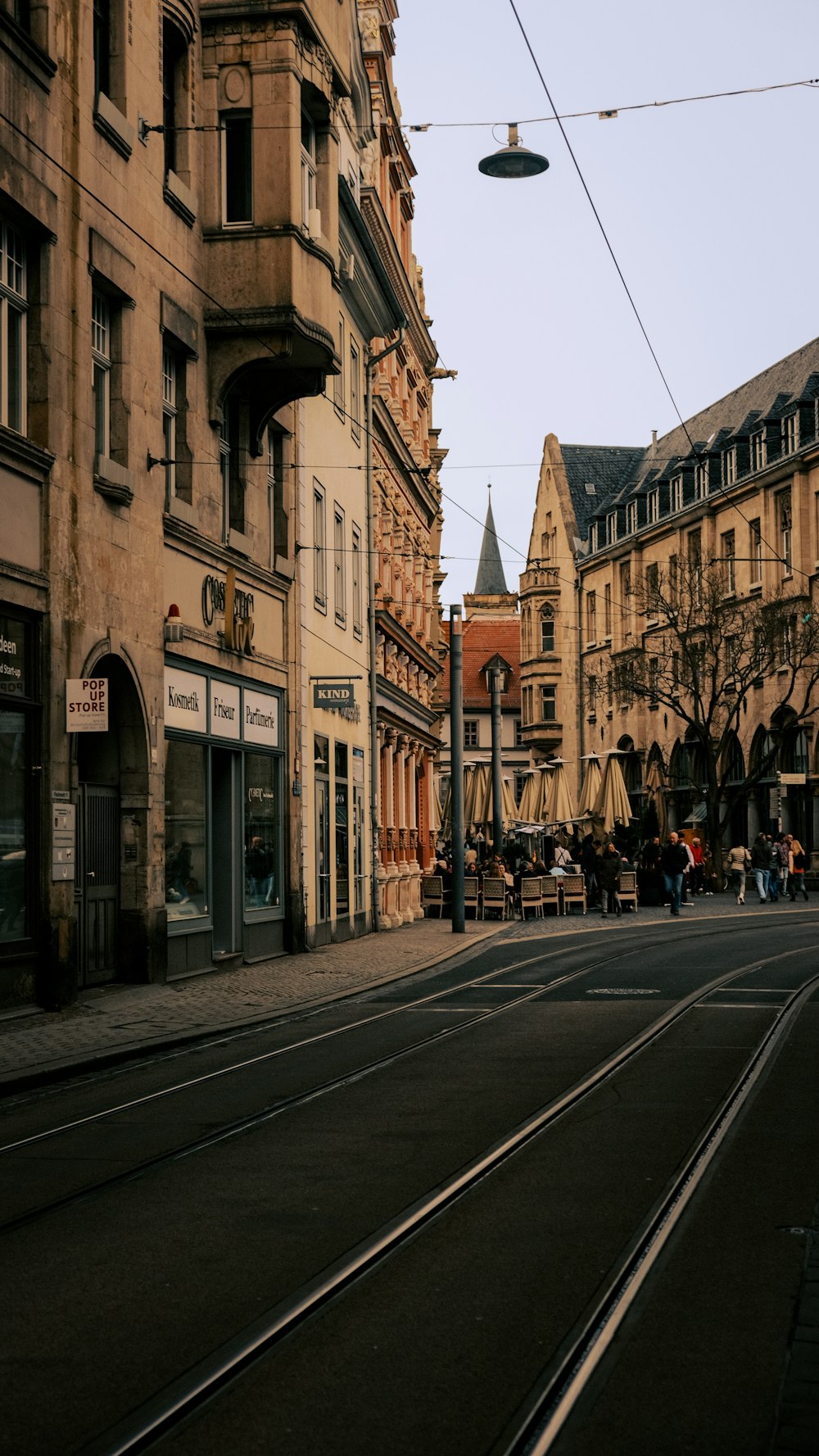 a city street with a train on the tracks