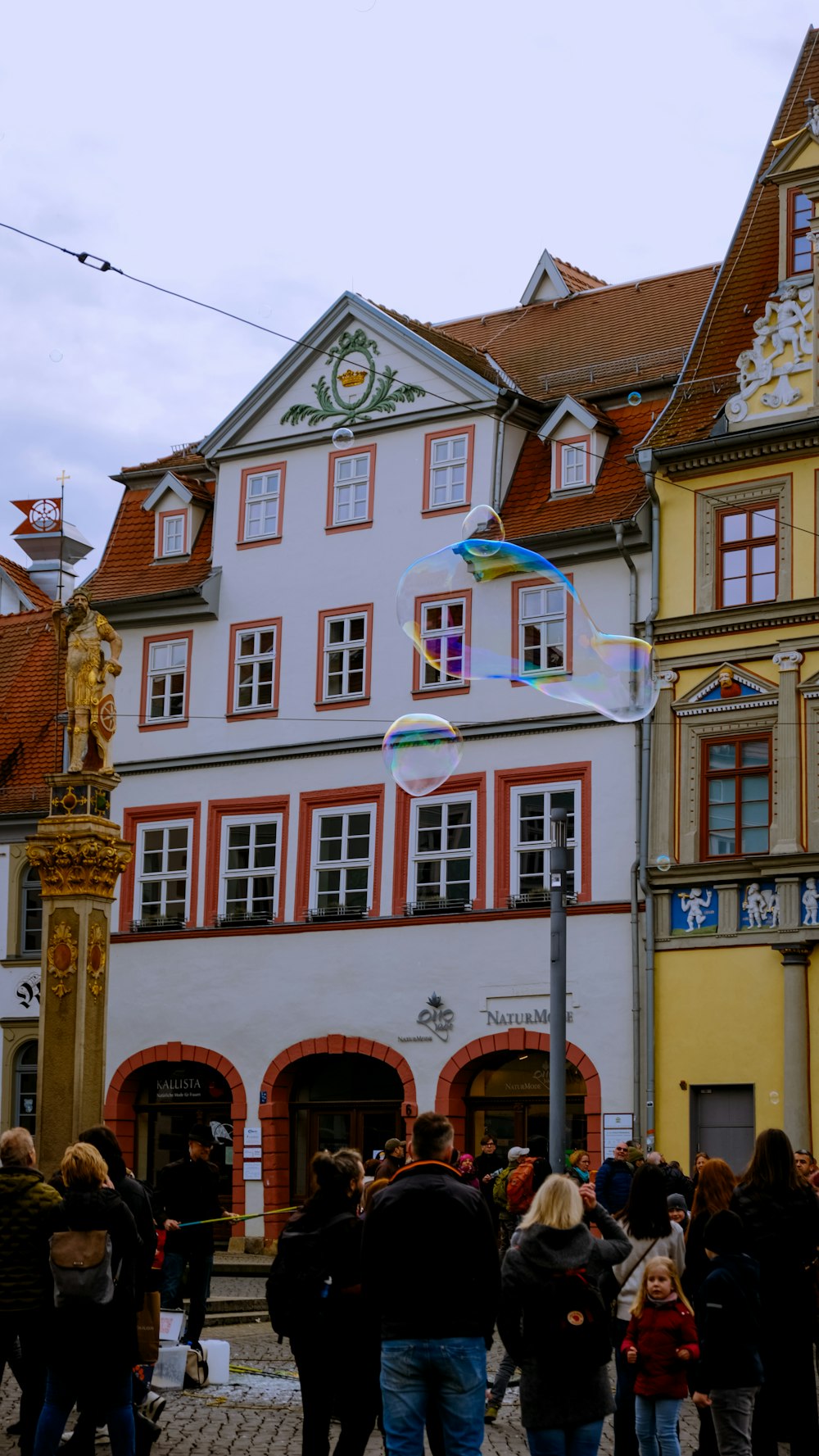 a group of people standing in front of a building