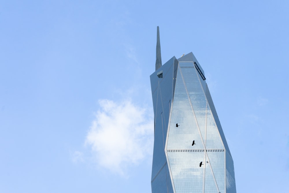 a very tall building with a sky background