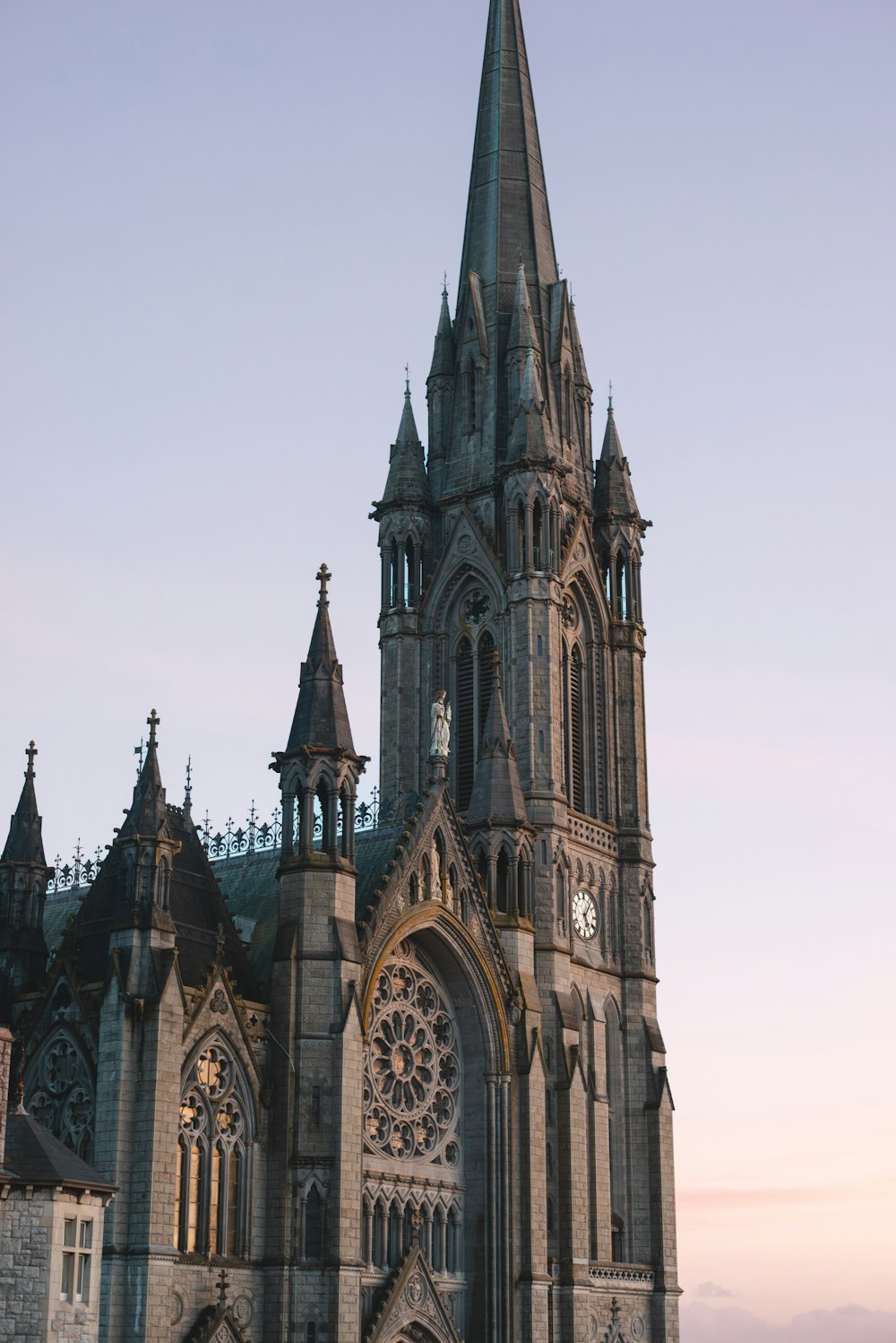 a large cathedral with a clock on the front of it