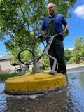 a man standing next to a yellow fire hydrant