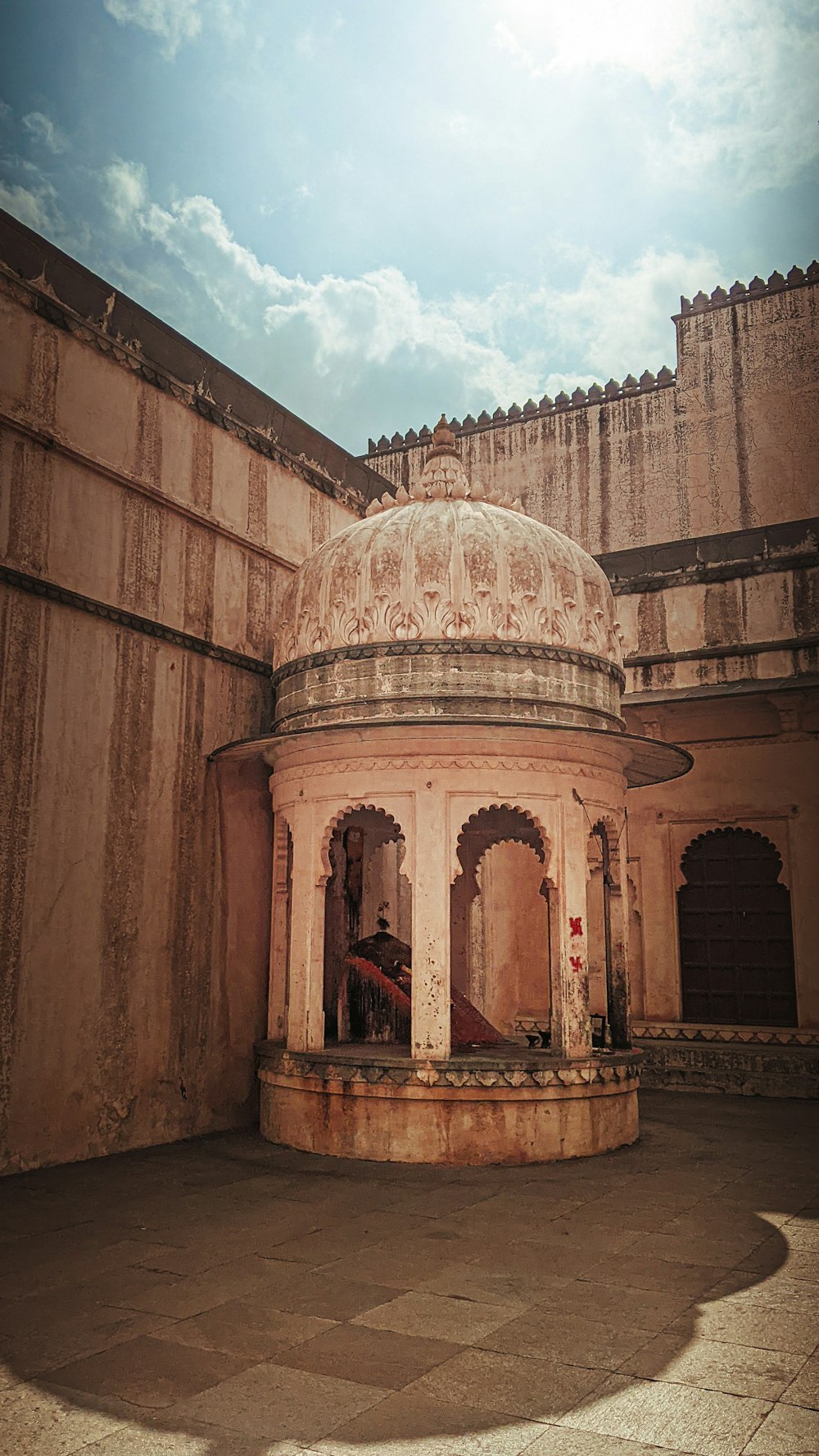 an old building with a dome in the middle of it