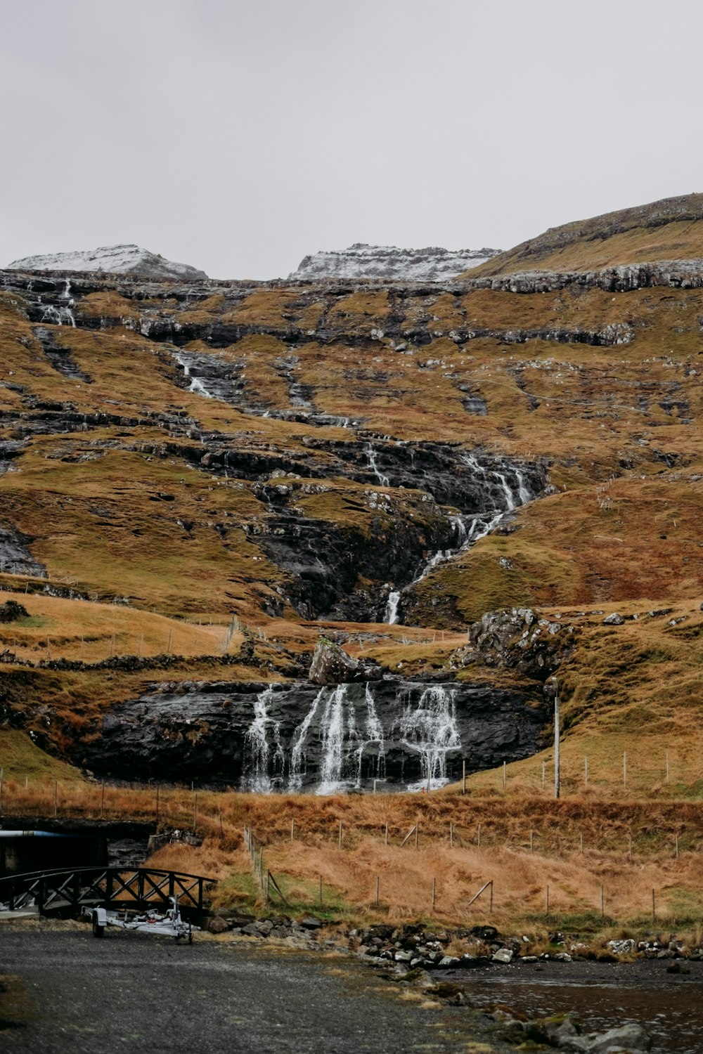 a small waterfall in the middle of a field