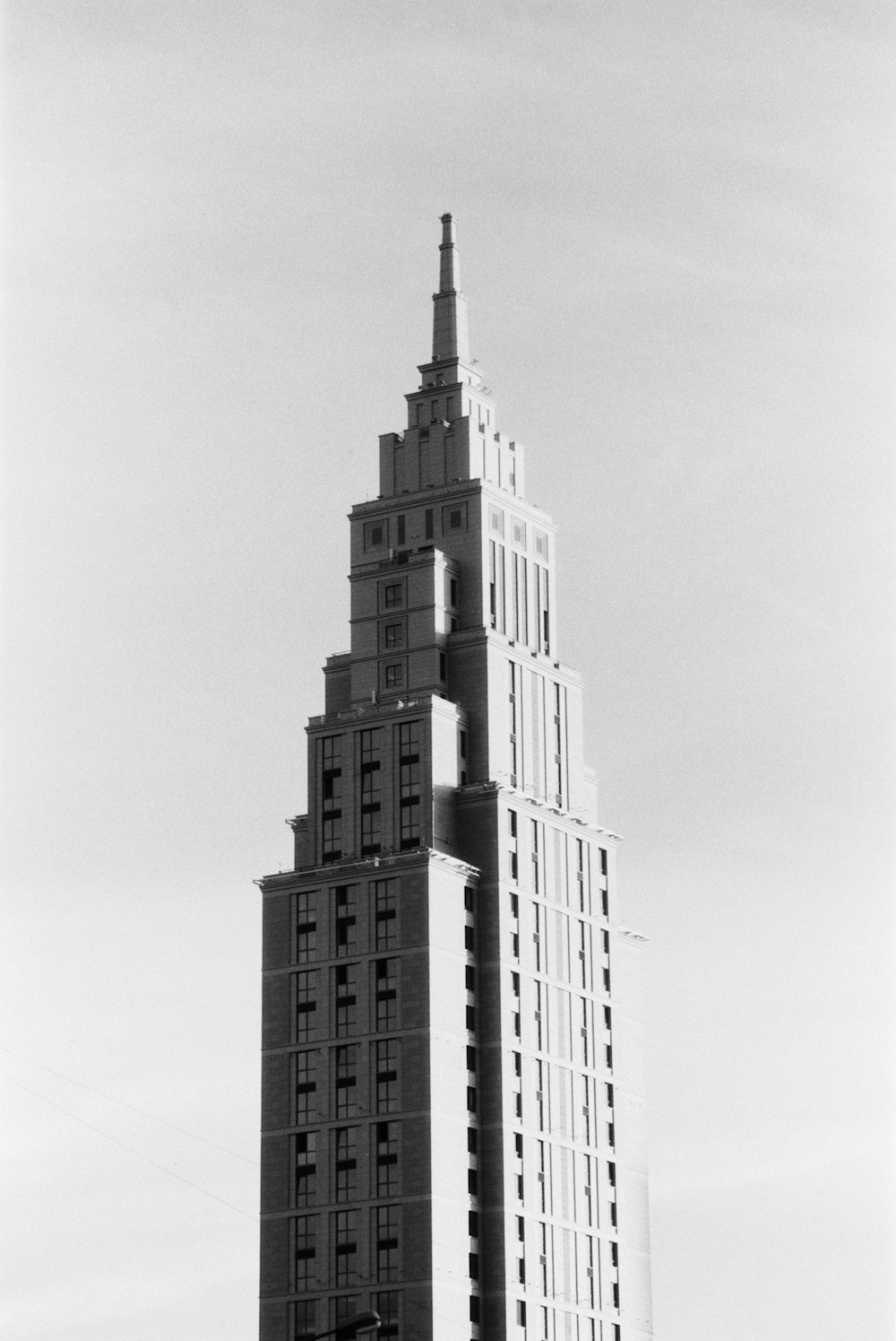 a black and white photo of a tall building