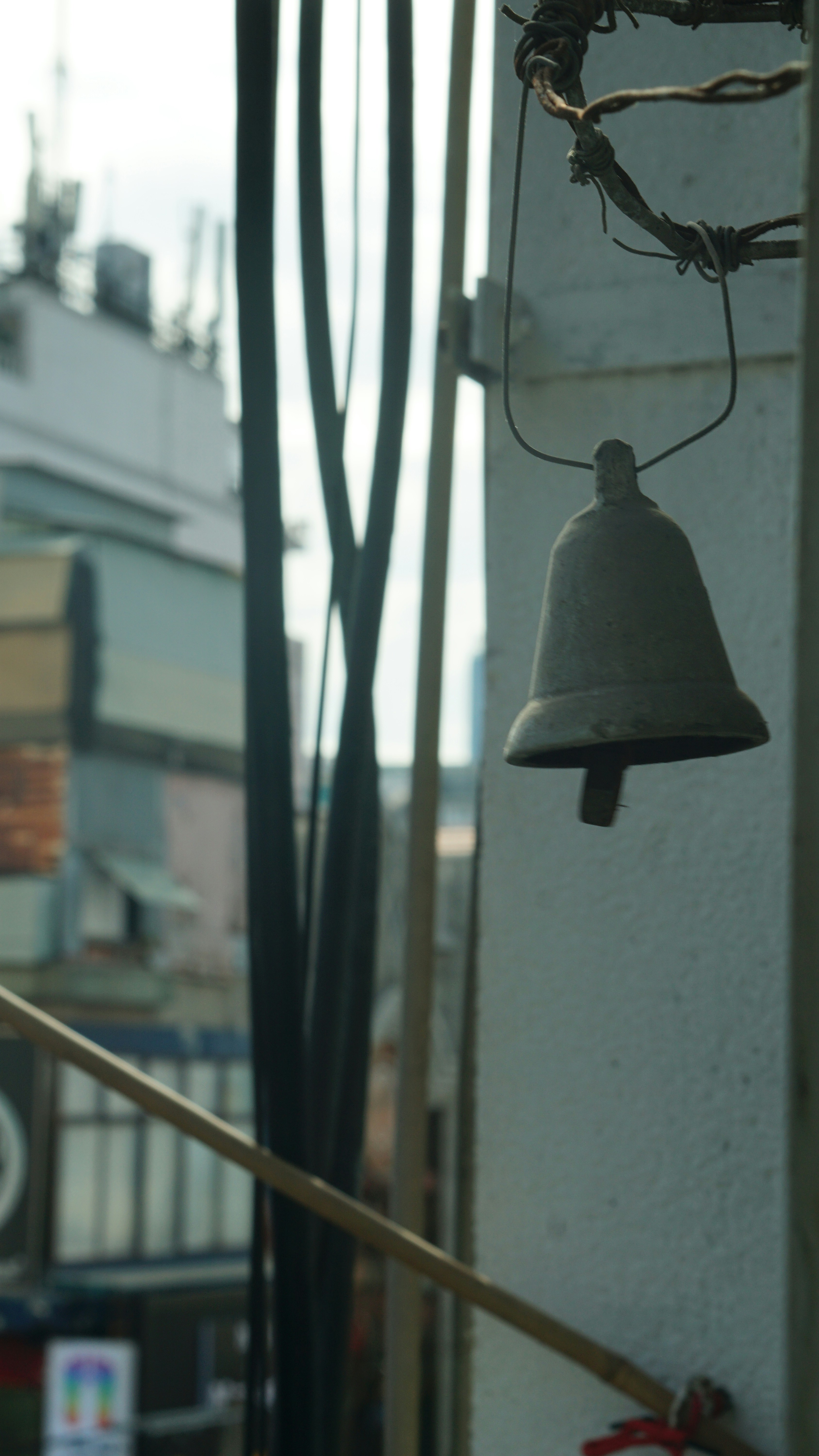 a bell hanging from the side of a building