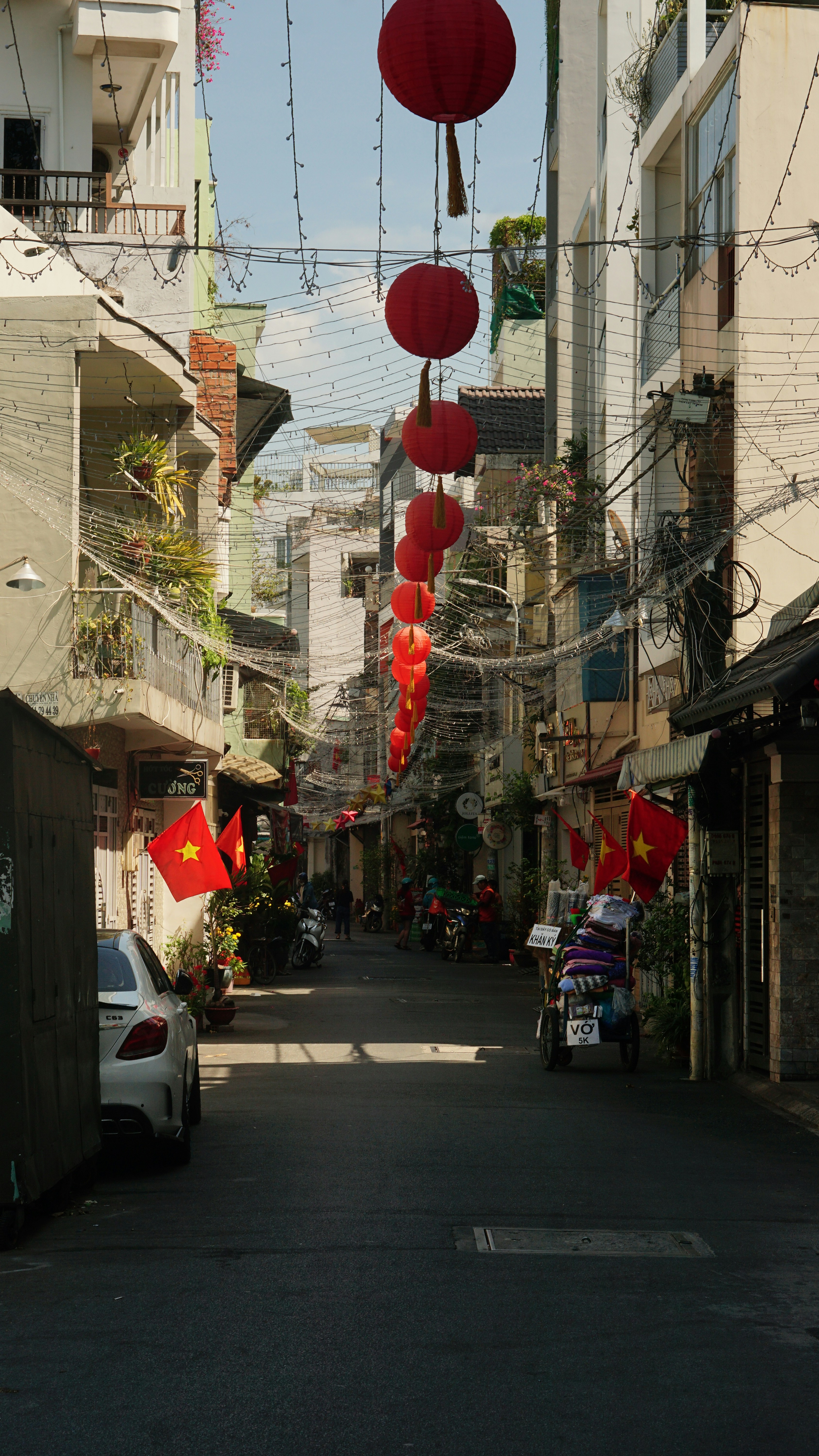 Street with lantern buntings during daytime photo – Free Car Image on  Unsplash, image size:3000x5332