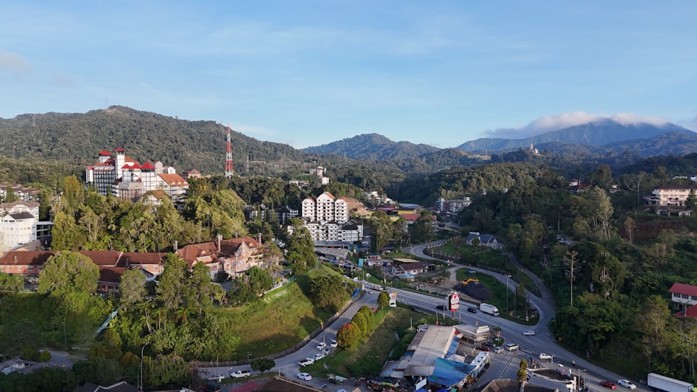 an aerial view of a city with mountains in the background