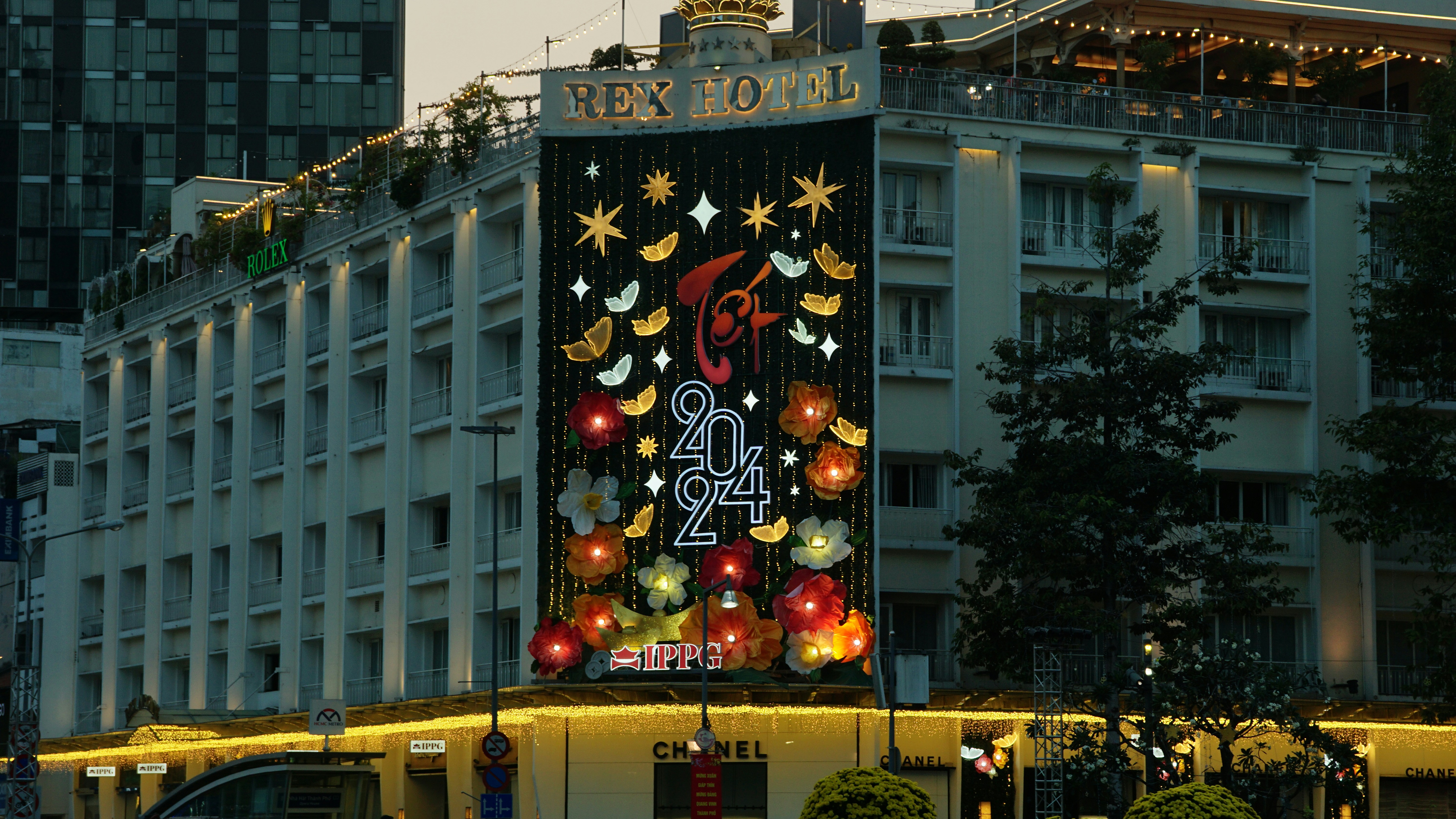 a large building with a christmas decoration on it's side