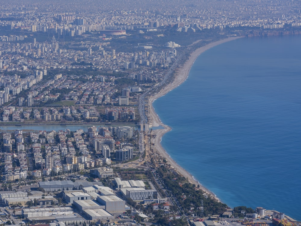 an aerial view of a city and the ocean