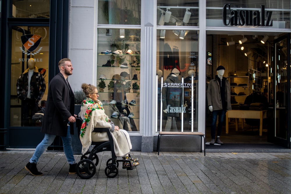 a man pushing a child in a stroller