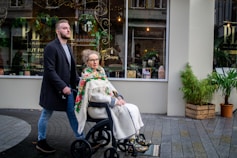 a man and a woman walking down a street