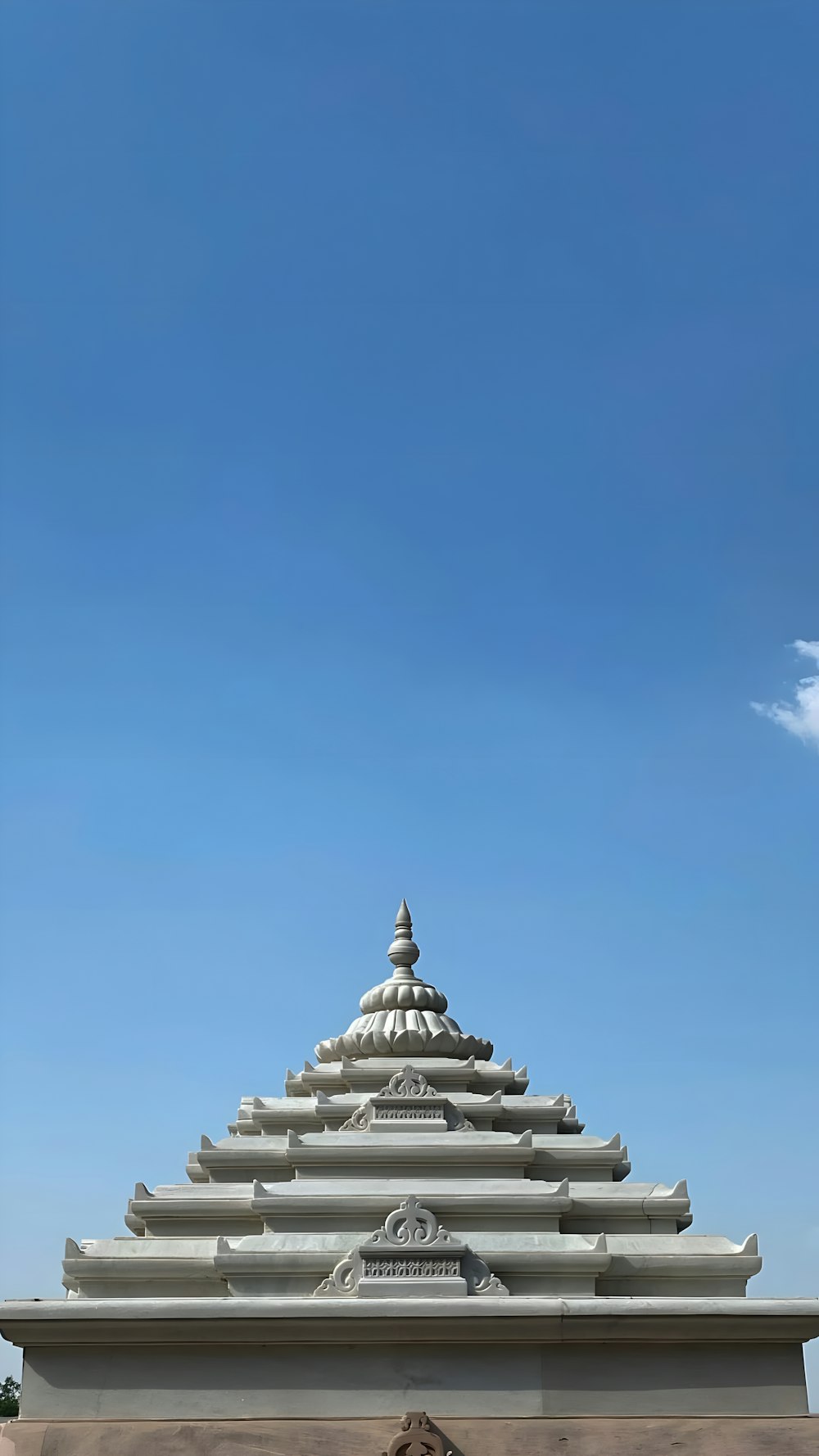 a large white building with a sky background