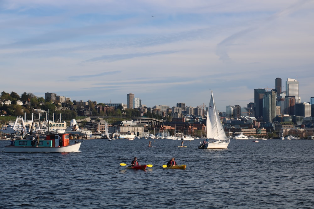 a group of people in small boats on a body of water