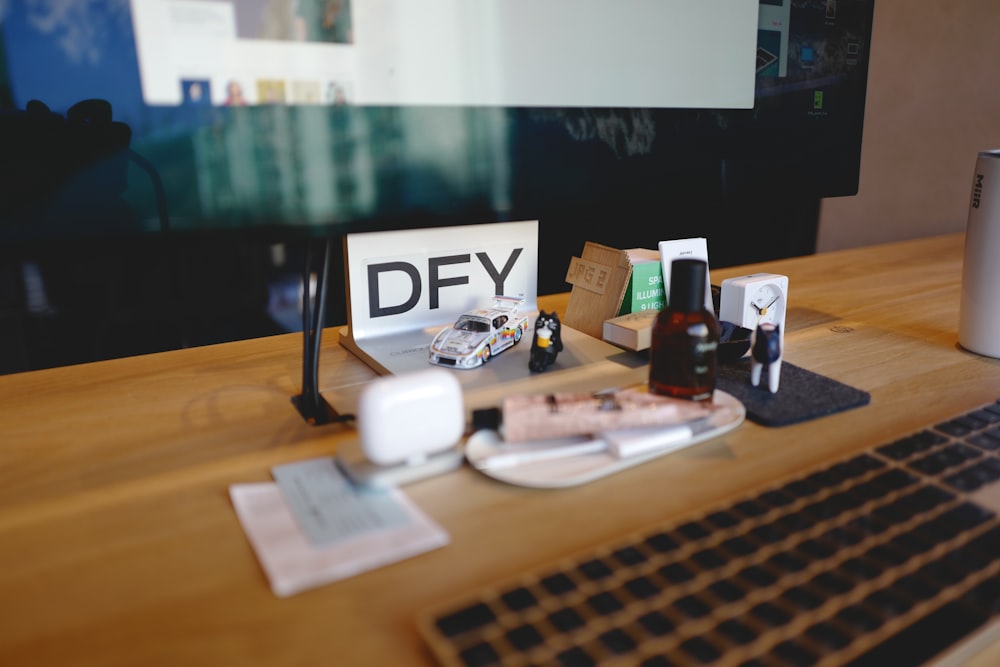 a desk with a keyboard, mouse and monitor