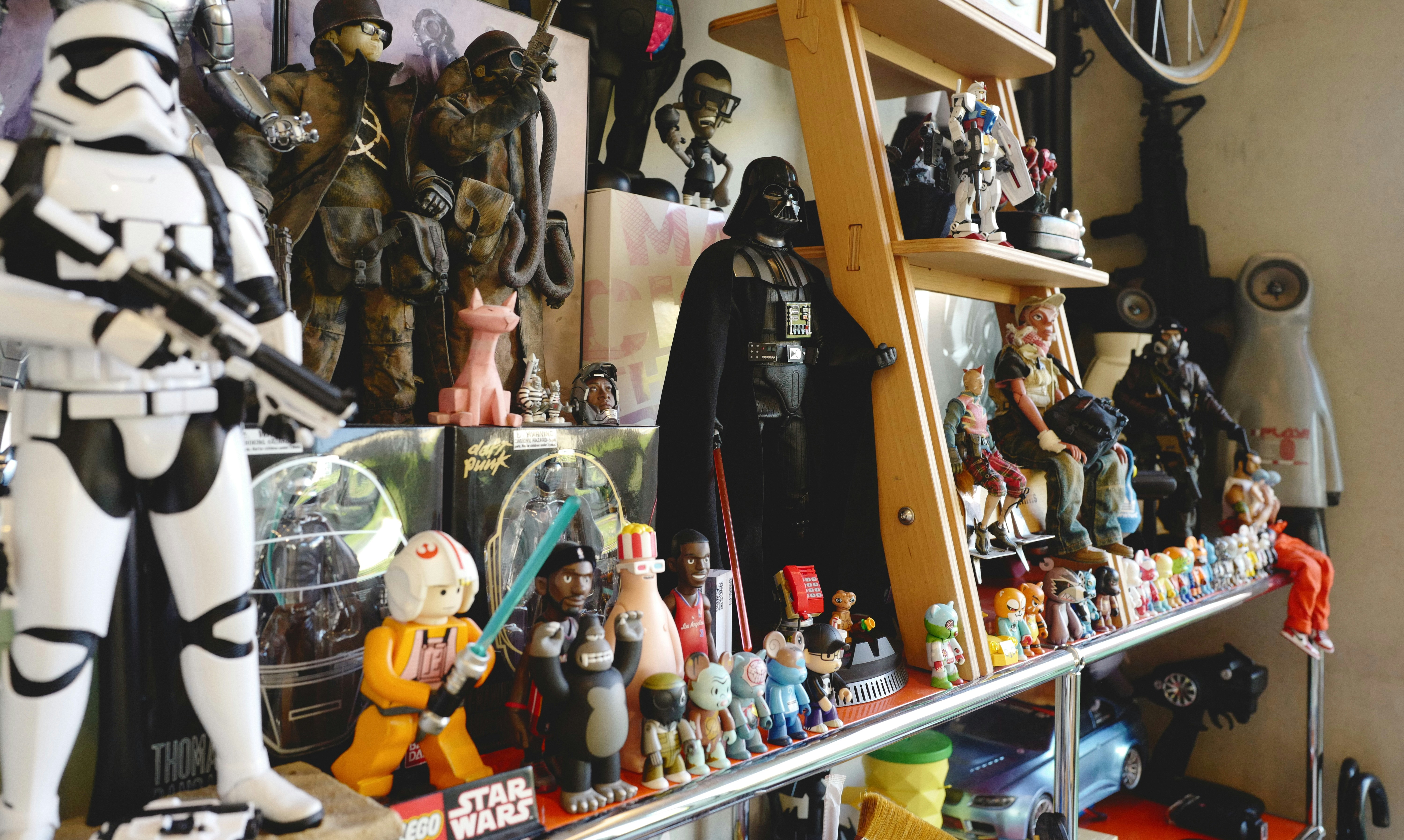 Various figures in factions on a shelf
