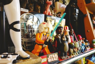 a shelf full of star wars toys and figurines