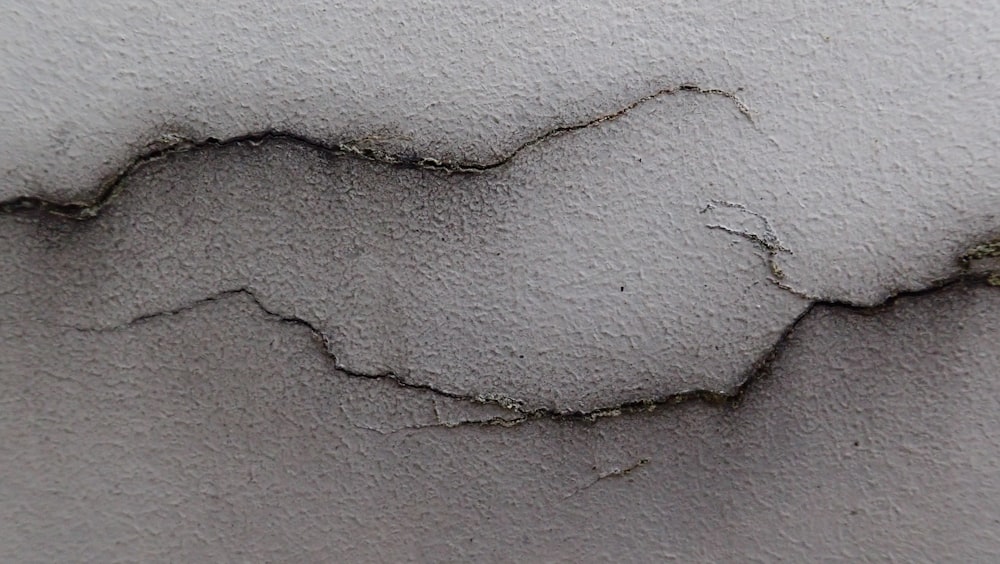 a white wall with a crack in it