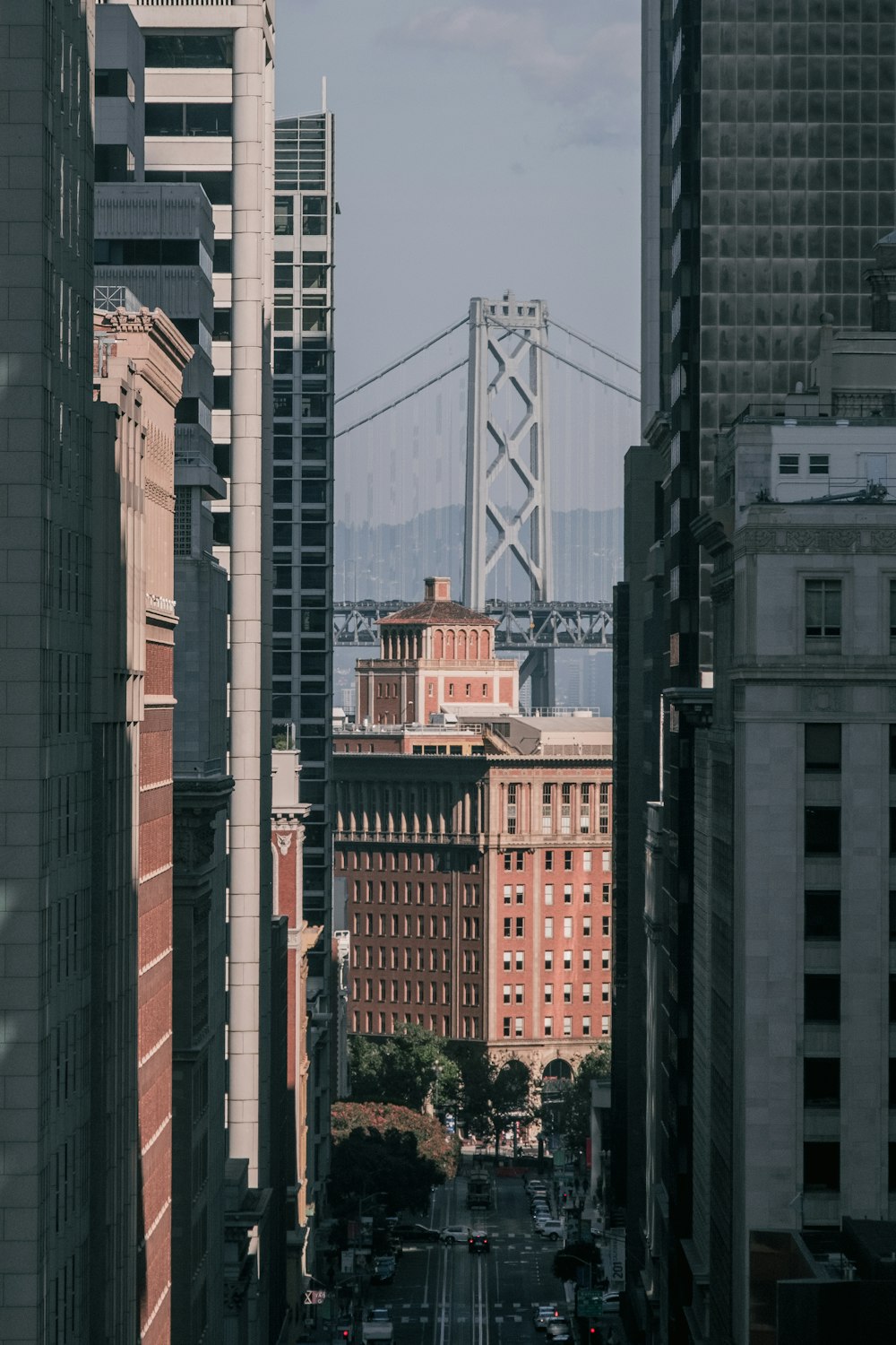 a view of a city with a bridge in the background