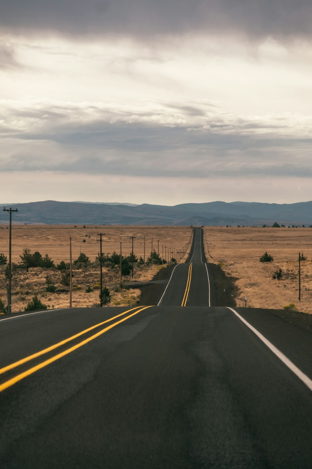 a long empty road in the middle of nowhere