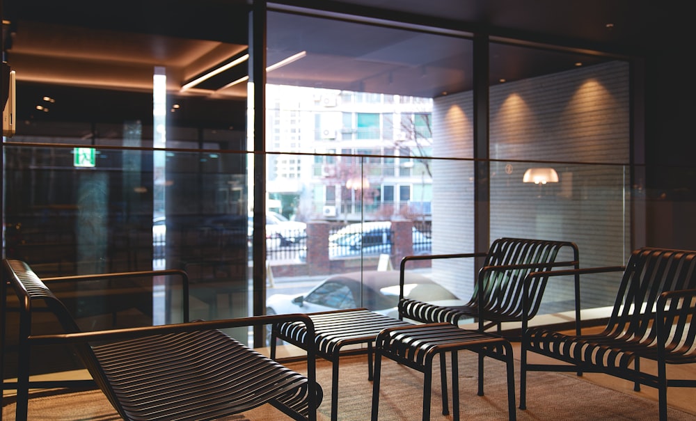 a row of chairs sitting in front of a window