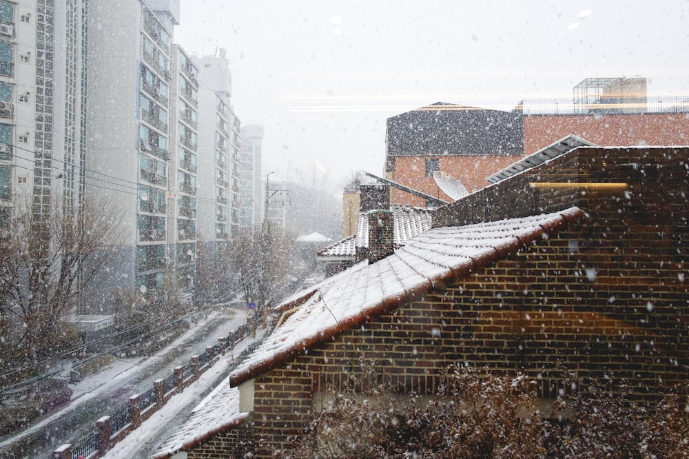 a view of a snowy city from a window