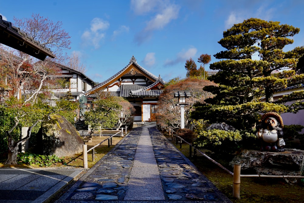 a walkway in front of a building in a park