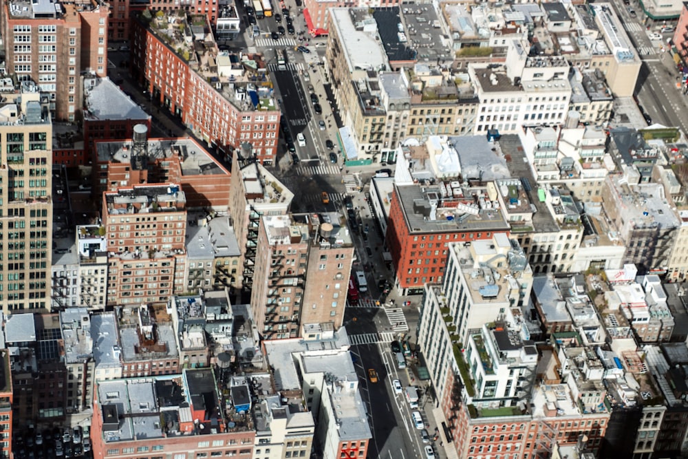 an aerial view of a city with tall buildings