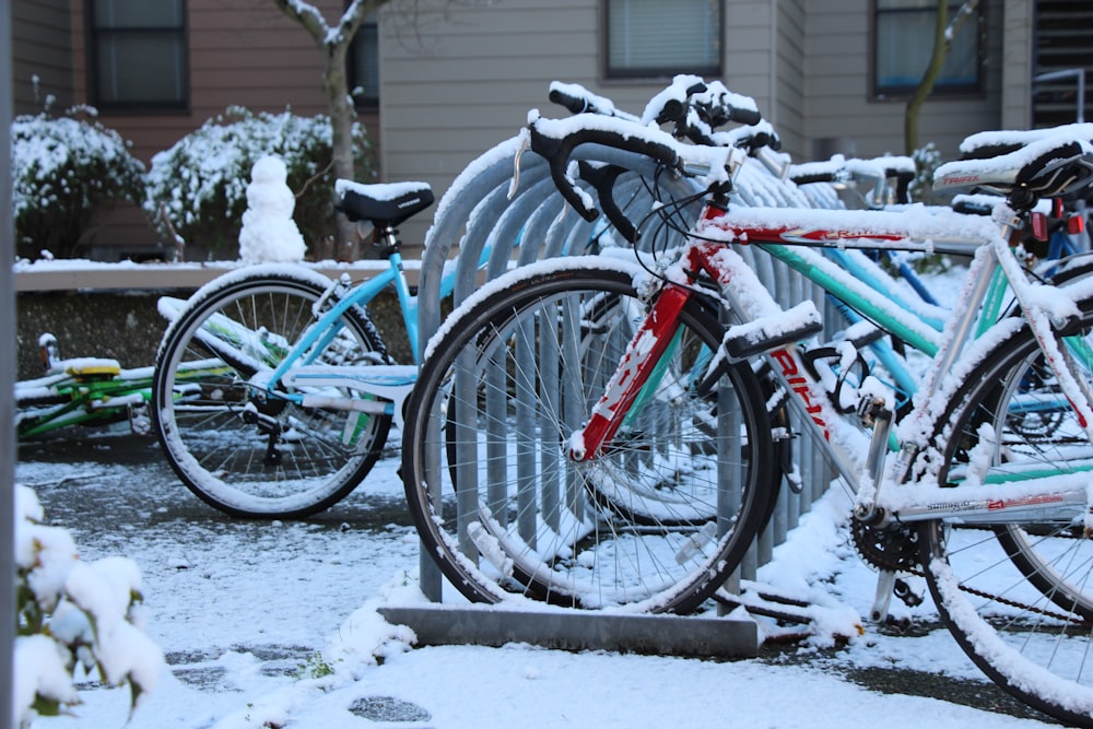 a bunch of bikes that are covered in snow