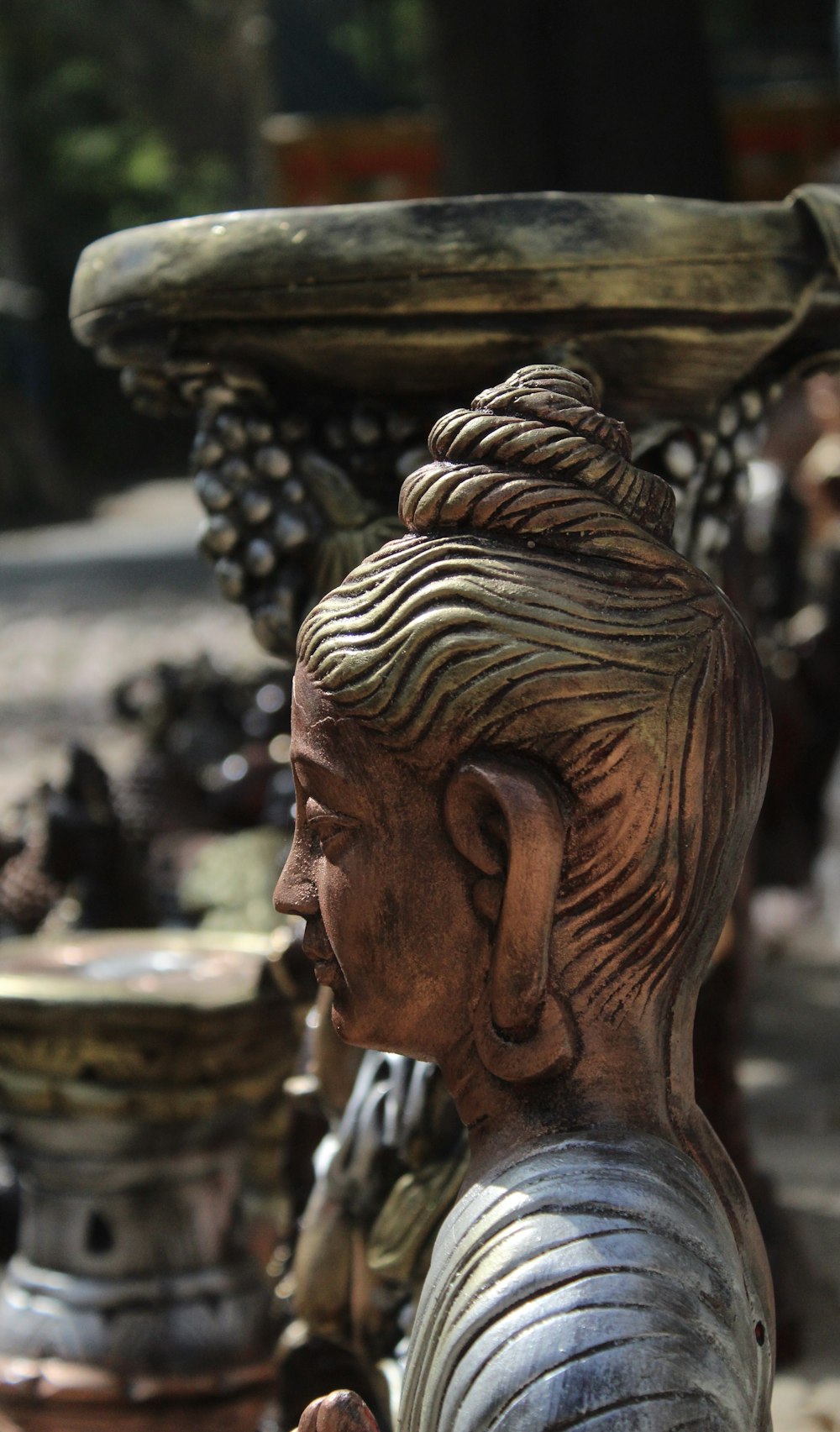 a statue of a woman with a basket on her head