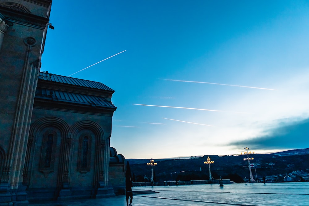 a building with a clock tower and a sky background